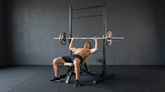 Home gym weight bench and squat rack used for bench press