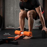 Compact abdominal trainer showing foot placement, anchor point and body alignment